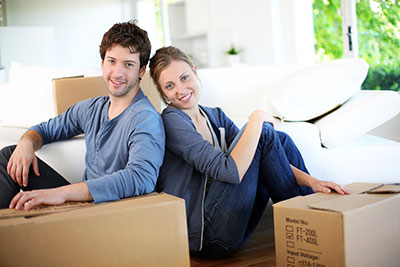 image of a couple packing up to move out of rent house